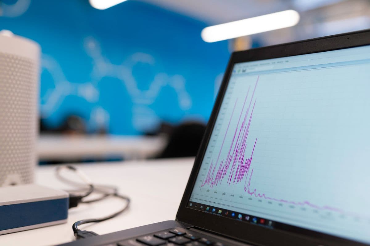 Laptop showing a growth graph of website analytics